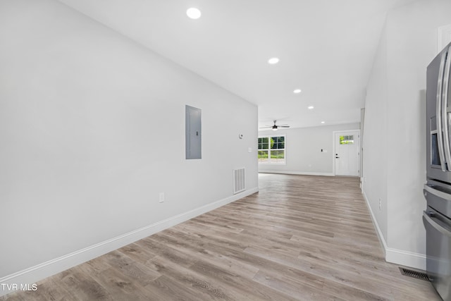 interior space with light wood-type flooring and electric panel