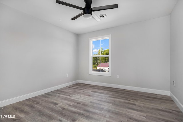 unfurnished room featuring ceiling fan and hardwood / wood-style flooring