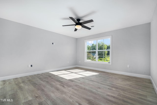 spare room featuring ceiling fan and light hardwood / wood-style floors