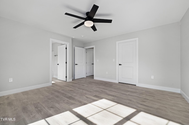 unfurnished bedroom featuring ceiling fan and light wood-type flooring