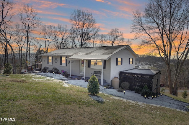 view of front of property with a lawn