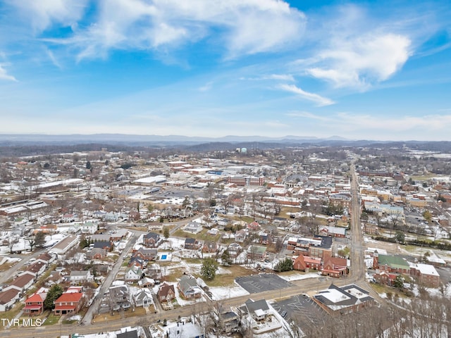 snowy aerial view with a mountain view