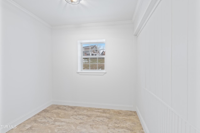 empty room featuring crown molding