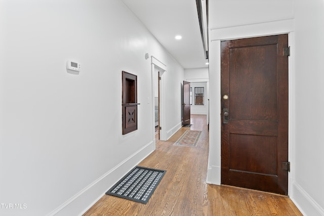 corridor featuring light hardwood / wood-style floors