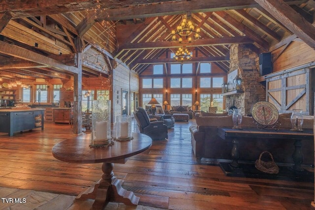 unfurnished dining area with high vaulted ceiling, a chandelier, hardwood / wood-style flooring, and beam ceiling