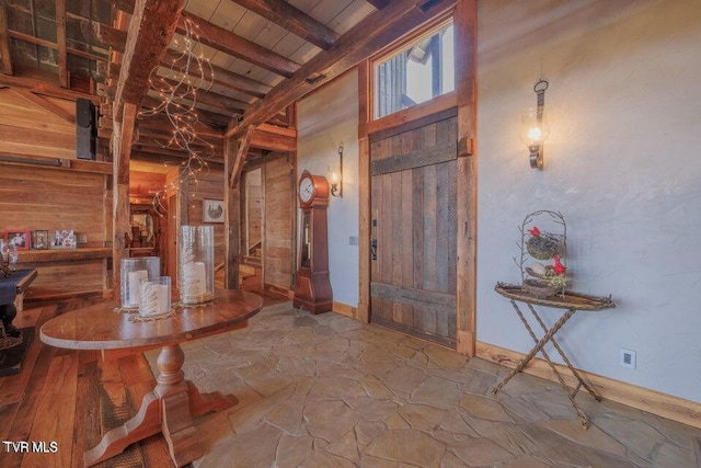 foyer featuring beam ceiling and wood ceiling