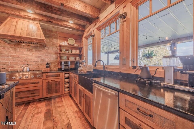 kitchen featuring stainless steel appliances, sink, light hardwood / wood-style flooring, custom exhaust hood, and beam ceiling