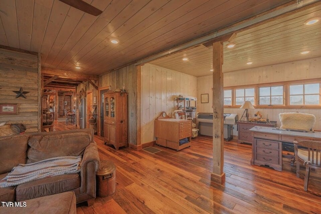 interior space featuring wooden walls, wooden ceiling, and hardwood / wood-style flooring