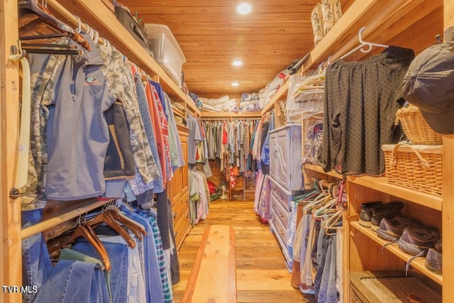 spacious closet with light hardwood / wood-style floors