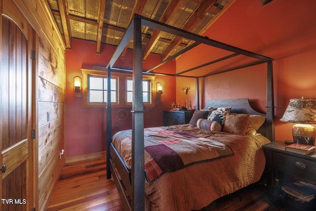 bedroom with wood-type flooring