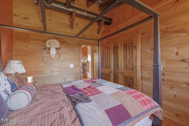 bedroom with wooden walls