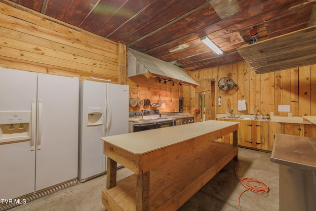 kitchen featuring wooden ceiling, wood walls, and white refrigerator with ice dispenser