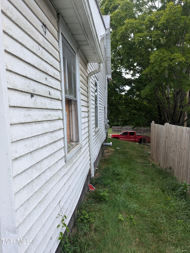 view of home's exterior featuring a lawn