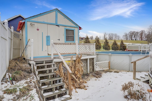 view of outbuilding with fence