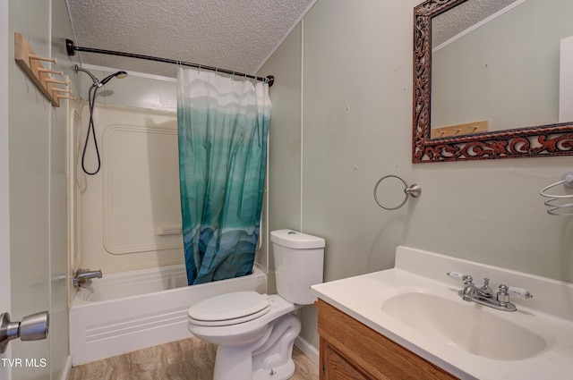 full bath featuring vanity, wood finished floors, shower / bath combo, a textured ceiling, and toilet