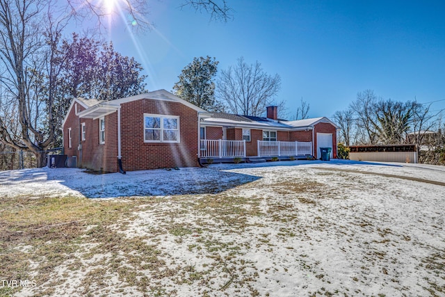 view of front of home with covered porch and a garage