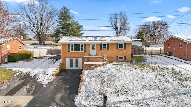 view of front of property with french doors and central AC