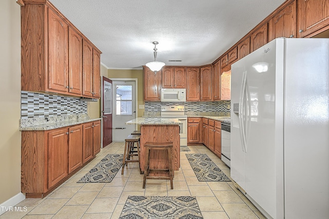 kitchen with a kitchen island, white appliances, a kitchen bar, and tasteful backsplash