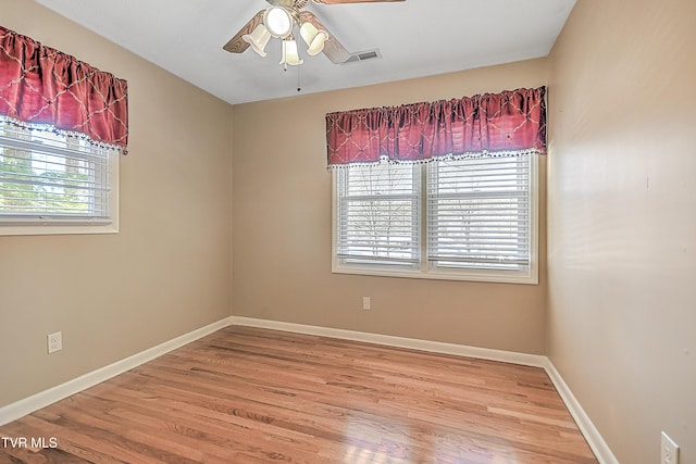 unfurnished room featuring hardwood / wood-style floors and ceiling fan