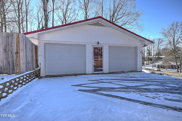 view of snow covered garage