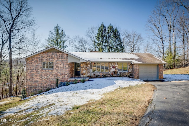 single story home with a porch and a garage