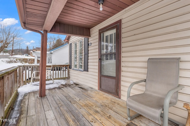 view of snow covered deck