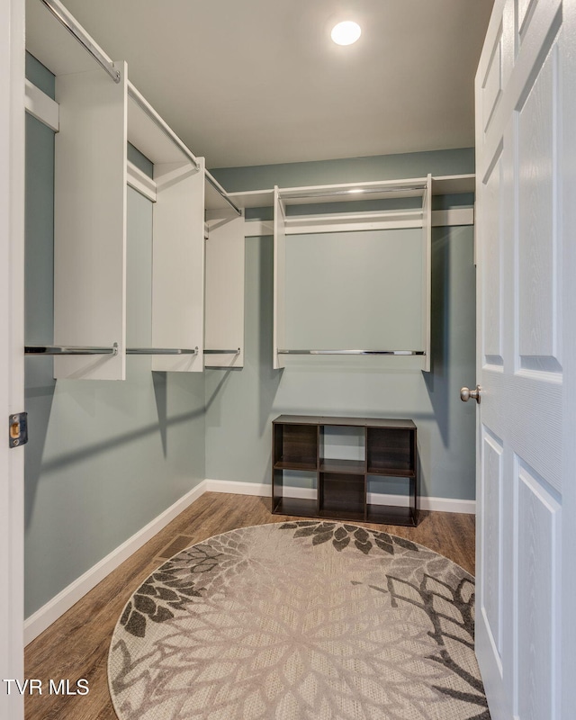 walk in closet featuring hardwood / wood-style floors