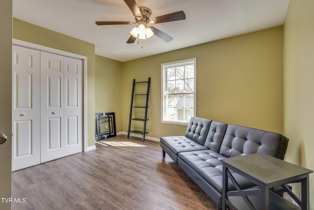 living room featuring hardwood / wood-style flooring and ceiling fan