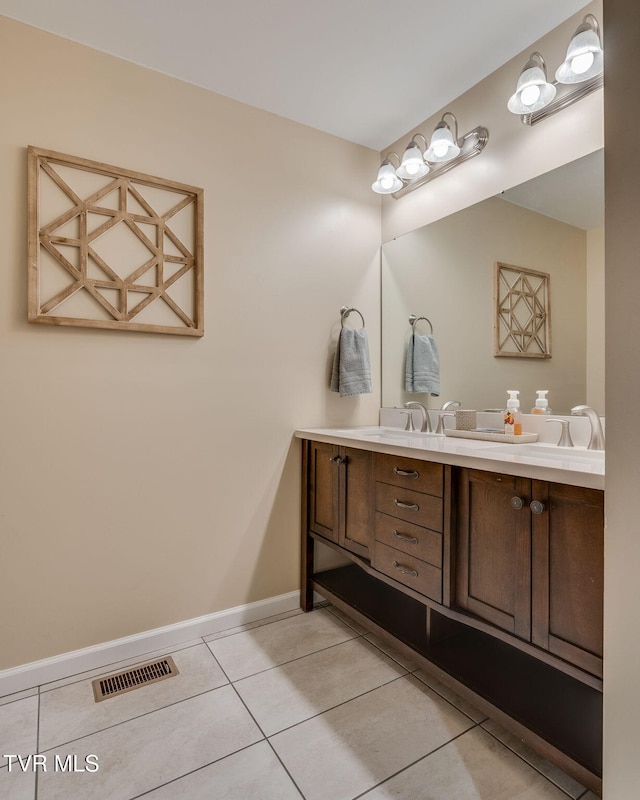 bathroom with vanity and tile patterned flooring