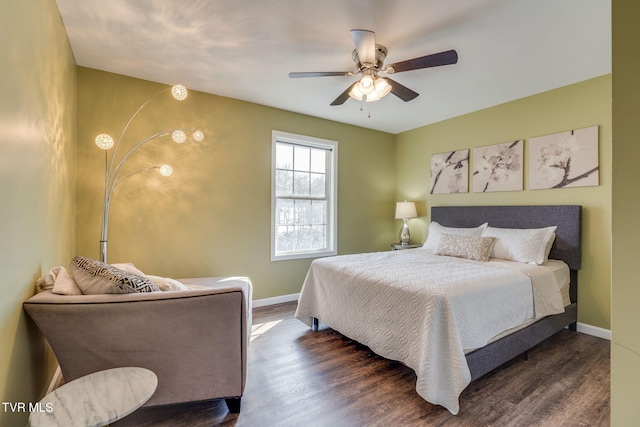 bedroom with ceiling fan and dark wood-type flooring