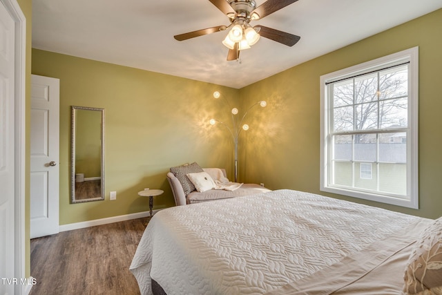 bedroom featuring ceiling fan and hardwood / wood-style floors