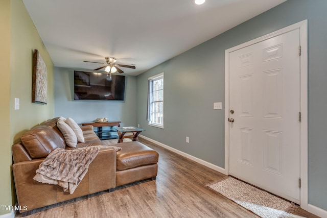 living room with ceiling fan and hardwood / wood-style floors