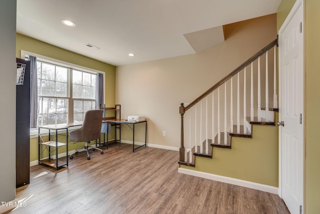 office space with wood-type flooring