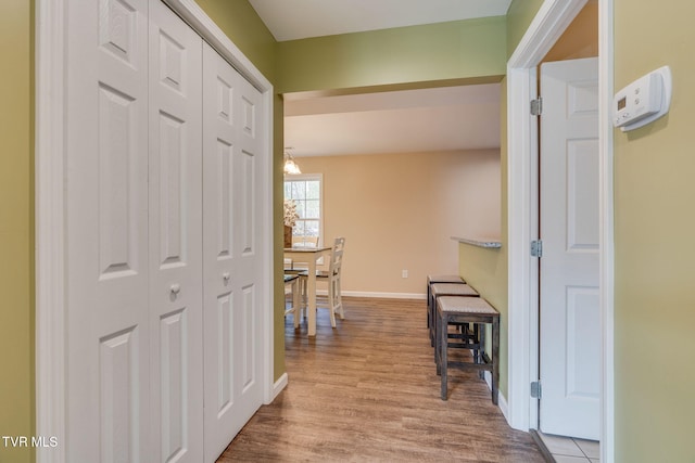 hall with light hardwood / wood-style flooring