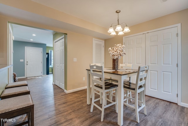 dining room featuring a chandelier and hardwood / wood-style flooring