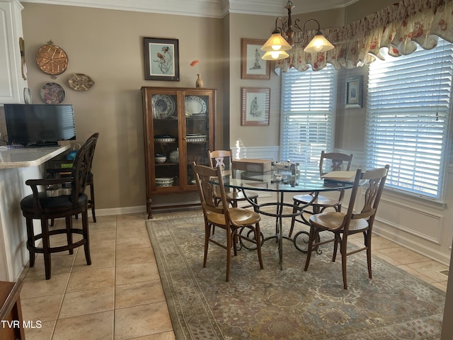 dining area featuring a chandelier, a healthy amount of sunlight, light tile patterned flooring, and crown molding