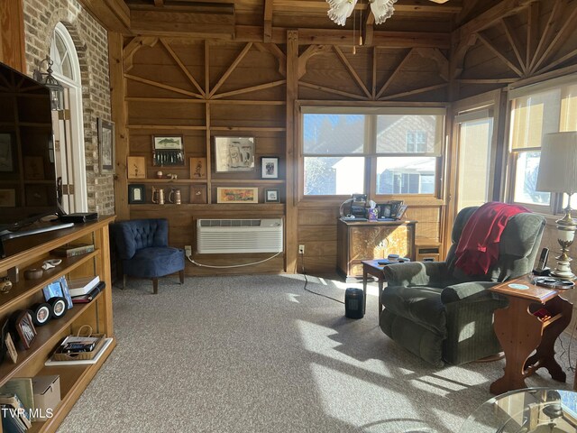 interior space with carpet, a wall mounted air conditioner, and wooden walls