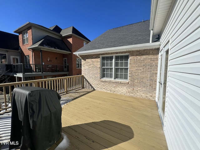 wooden deck with grilling area