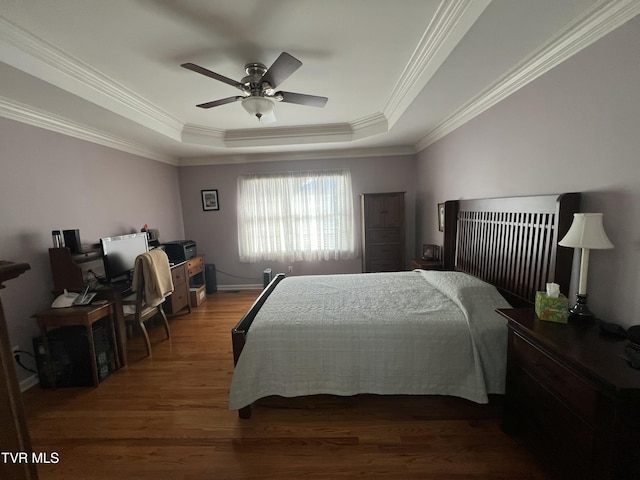 bedroom featuring crown molding, a ceiling fan, a raised ceiling, and dark wood-style flooring