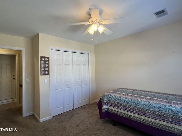 bedroom featuring a closet, visible vents, baseboards, and carpet flooring