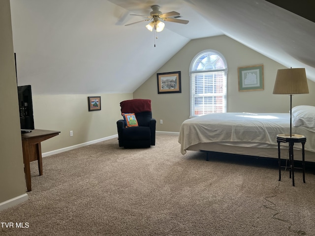 carpeted bedroom featuring vaulted ceiling and baseboards