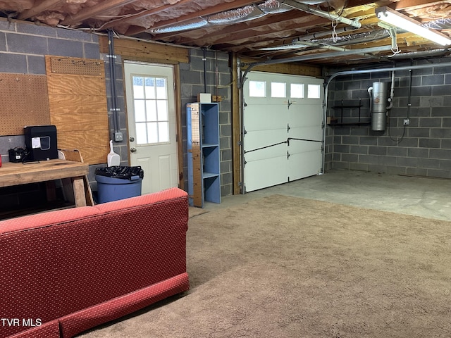 garage with concrete block wall