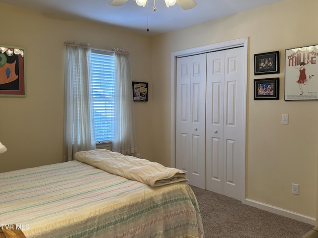 carpeted bedroom with ceiling fan, baseboards, and a closet