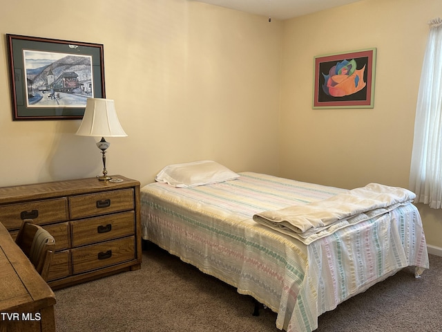 bedroom featuring dark colored carpet