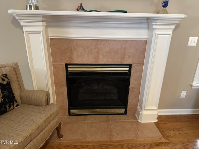 room details with a fireplace and baseboards