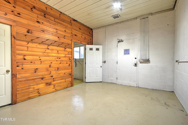 interior space featuring wood walls