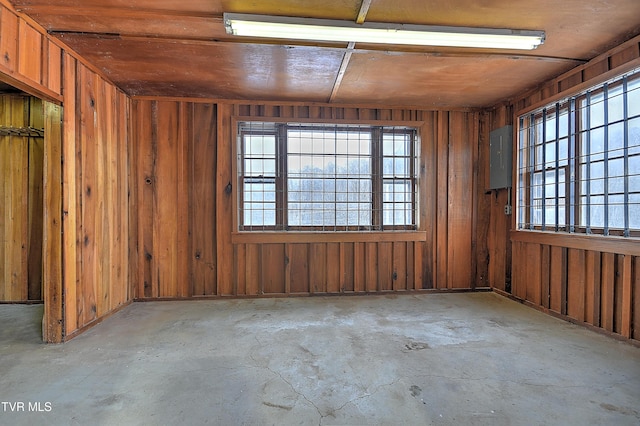 spare room with electric panel and wood ceiling