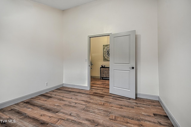 empty room with wood-type flooring