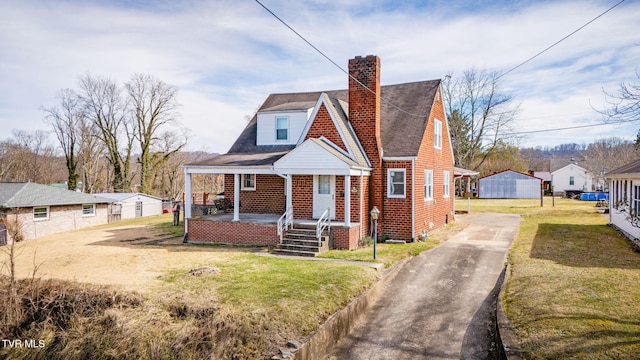 bungalow featuring a porch and a front yard