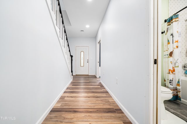 corridor featuring hardwood / wood-style flooring